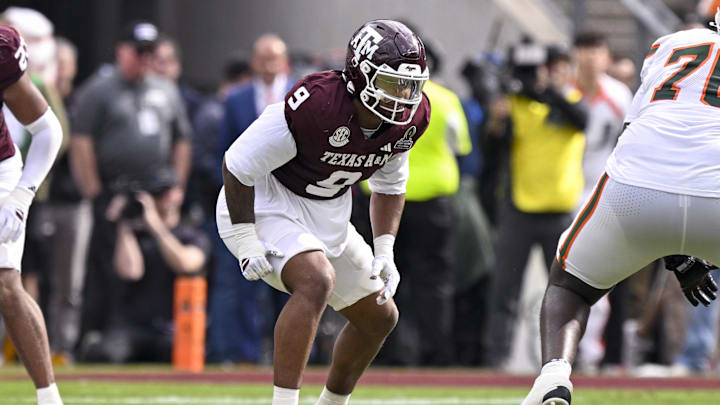 Dec 20, 2025; College Station, TX, USA; Texas A&M Aggies defensive end Cashius Howell (9) lines up during the game between the Aggies and the Hurricanes at Kyle Field. Mandatory Credit: Jerome Miron-Imagn Images