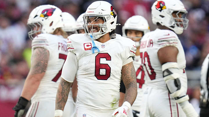 Arizona Cardinals running back James Conner (6) smiles as he comes out the huddle during their game against the New England Patriots at State Farm Stadium on Dec 15, 2024.