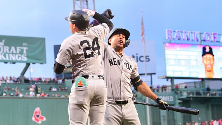 Jun 14, 2024; Boston, Massachusetts, USA; New York Yankees right fielder Alex Verdugo (24) celebrates his two-run home run against the Boston Red Sox with left fielder Juan Soto (22) during the first inning at Fenway Park. 