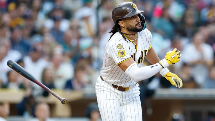 Mar 28, 2026; San Diego, California, USA; San Diego Padres right fielder Fernando Tatis Jr. (23) hits an RBI single during the third inning against the Detroit Tigers at Petco Park. Mandatory Credit: David Frerker-Imagn Images