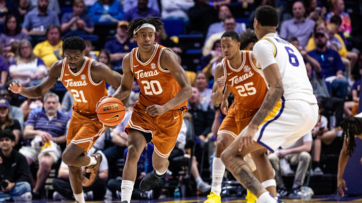 Feb 1, 2025; Baton Rouge, Louisiana, USA;  Texas Longhorns guard Tre Johnson (20) brings the ball up court against LSU Tigers forward Robert Miller III (6) during the second half at Pete Maravich Assembly Center. Mandatory Credit: Stephen Lew-Imagn Images