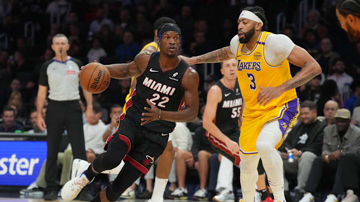 Dec 4, 2024; Miami, Florida, USA;  Miami Heat forward Jimmy Butler (22) drives past Los Angeles Lakers forward Anthony Davis (3) in the first half at Kaseya Center. Mandatory Credit: Jim Rassol-Imagn Images