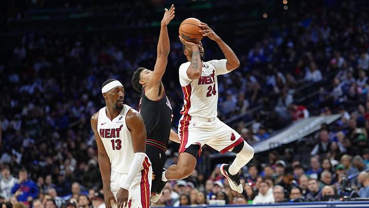Nov 23, 2025; Philadelphia, Pennsylvania, USA; Miami Heat guard Norman Powell (24) jumps to shoot against Philadelphia 76ers guard Quentin Grimes (5) in the second quarter at Xfinity Mobile Arena. Mandatory Credit: Kyle Ross-Imagn Images
