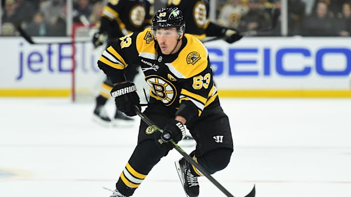 Feb 27, 2025; Boston, Massachusetts, USA; Boston Bruins left wing Brad Marchand (63) skates with the puck during the third period against the New York Islanders at TD Garden. Mandatory Credit: Bob DeChiara-Imagn Images