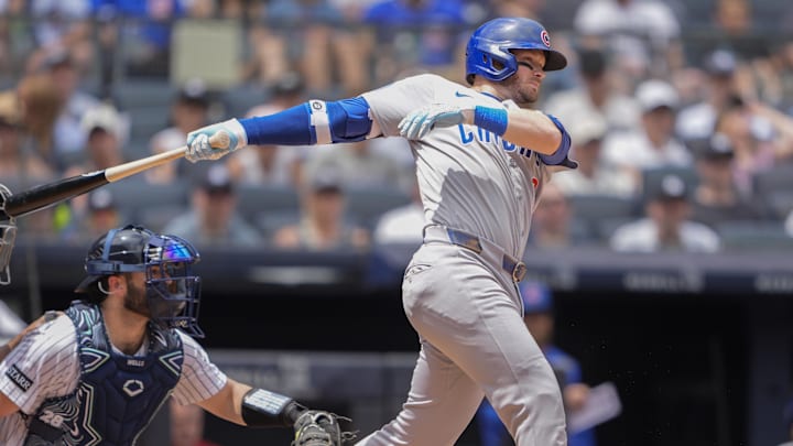 Jul 13, 2025; Bronx, New York, USA; Chicago Cubs left fielder Ian Happ (8)] hits a single against the New York Yankees during the second inning at Yankee Stadium. 