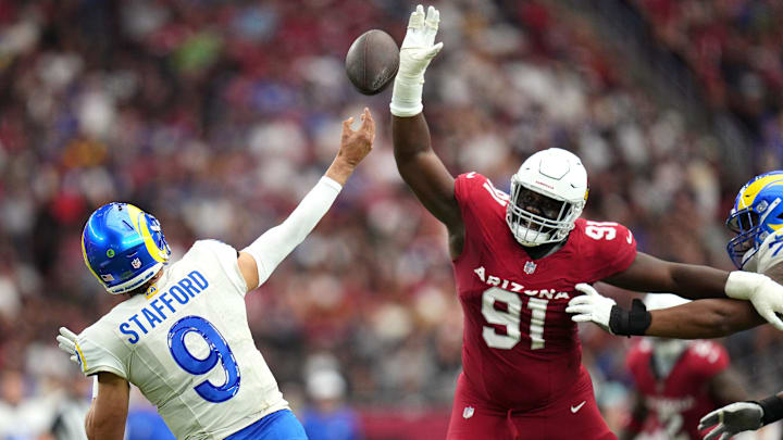 Arizona Cardinals defensive lineman L.J. Collier (91) attempts to block a pass by Los Angeles Rams quarterback Matthew Stafford (9) on Sept. 15, 2024, at State Farm Stadium in Glendale.