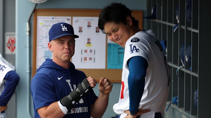 Sep 21, 2025; Los Angeles, California, USA; Los Angeles Dodgers injured catcher Will Smith (left) with his right hand in a brace talks with designated hitter Shohei Ohtani (17) during the eighth inning against the San Francisco Giants at Dodger Stadium. Mandatory Credit: Kiyoshi Mio-Imagn Images Sep 21, 2025; Los Angeles, California, USA; Los Angeles Dodgers injured catcher Will Smith (left) with his right hand in a brace talks with designated hitter Shohei Ohtani (17) during the eighth inning against the San Francisco Giants at Dodger Stadium. Mandatory Credit: Kiyoshi Mio-Imagn Images