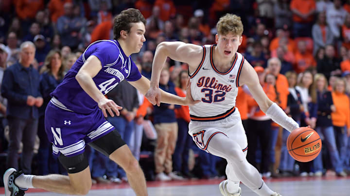 Jan 26, 2025; Champaign, Illinois, USA;  Illinois Fighting Illini guard Kasparas Jakucionis (32) drives the ball past Northwestern Wildcats guard Angelo Ciaravino (44) during the first half at State Farm Center. Mandatory Credit: Ron Johnson-Imagn Images