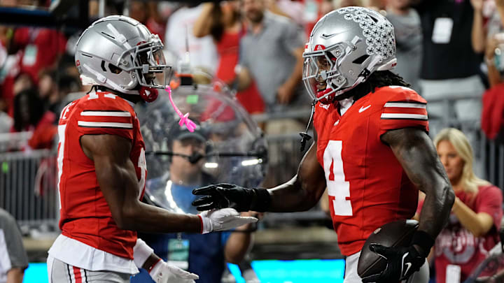 Ohio State Buckeyes wide receiver Carnell Tate (17) celebrates a touchdown by wide receiver Jeremiah Smith (4) during the first half of the NCAA football game against the Minnesota Golden Gophers at Ohio Stadium in Columbus on Oct. 4, 2025.