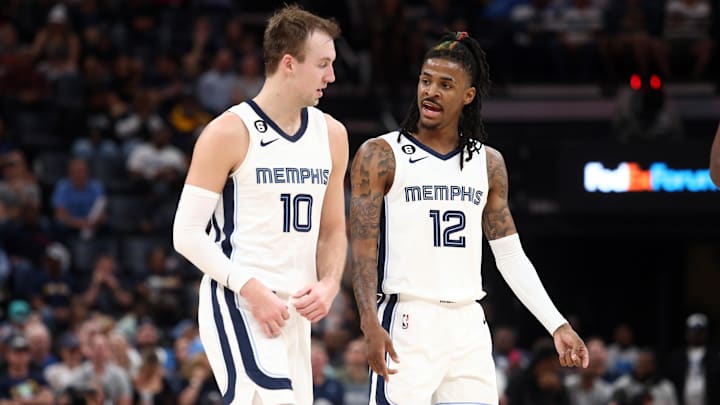 Apr 4, 2023; Memphis, Tennessee, USA; Memphis Grizzlies guard Luke Kennard (10) and Memphis Grizzlies guard Ja Morant (12) talk during the second half against the Portland Trail Blazers at FedExForum. Mandatory Credit: Petre Thomas-USA TODAY Sports