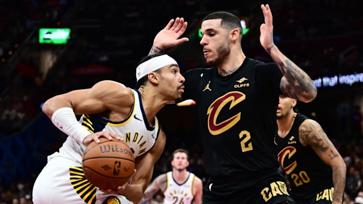 Nov 21, 2025; Cleveland, Ohio, USA; Indiana Pacers guard Andrew Nembhard (2) drives to the basket against Cleveland Cavaliers guard Lonzo Ball (2) during the second half at Rocket Arena. Mandatory Credit: Ken Blaze-Imagn Images Nov 21, 2025; Cleveland, Ohio, USA; Indiana Pacers guard Andrew Nembhard (2) drives to the basket against Cleveland Cavaliers guard Lonzo Ball (2) during the second half at Rocket Arena. Mandatory Credit: Ken Blaze-Imagn Images