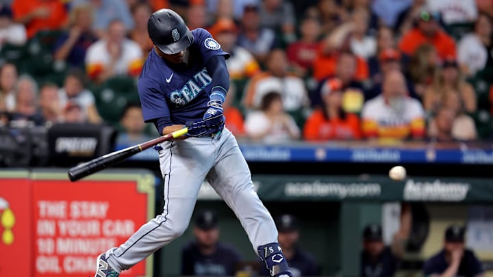 Sep 25, 2024; Houston, Texas, USA; Seattle Mariners second baseman Jorge Polanco (7) hits a single against the Houston Astros during the second inning at Minute Maid Park. Mandatory Credit: Erik Williams-Imagn Images