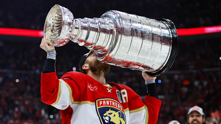 Matthew Tkachuk kisses the Stanley Cup after Florida won the 2024 Final.