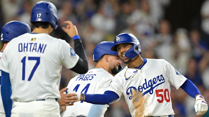 Sep 10, 2025; Los Angeles, California, USA; Los Angeles Dodgers shortstop Mookie Betts (50) is greeted at the plate by designated hitter Shohei Ohtani (17) after hitting a grand slam home run during the eighth inning against the Colorado Rockies at Dodger Stadium. Mandatory Credit: Jayne Kamin-Oncea-Imagn Images