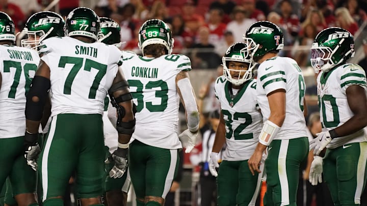 Sep 9, 2024; Santa Clara, California, USA; New York Jets guard John Simpson (76), New York Jets offensive tackle Tyron Smith (77), New York Jets tight end Tyler Conklin (83), New York Jets wide receiver Xavier Gipson (82), New York Jets quarterback Aaron Rodgers (8), and New York Jets running back Breece Hall (20) in the huddle against the San Francisco 49ers in the fourth quarter at Levi's Stadium. Sep 9, 2024; Santa Clara, California, USA; New York Jets guard John Simpson (76), New York Jets offensive tackle Tyron Smith (77), New York Jets tight end Tyler Conklin (83), New York Jets wide receiver Xavier Gipson (82), New York Jets quarterback Aaron Rodgers (8), and New York Jets running back Breece Hall (20) in the huddle against the San Francisco 49ers in the fourth quarter at Levi's Stadium.
