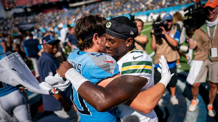 Tennessee Titans linebacker Jack Gibbens (50) greets Green Bay Packers quarterback Malik Willis (2) after the packers won 30-14 at Nissan Stadium in Nashville, Tenn., Sunday, Sept. 22, 2024.