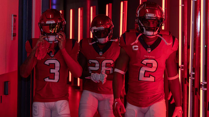  Houston Texans wide receiver Tank Dell (3) running back Devin Singletary (26), and wide receiver Robert Woods (2) make their way to the field before playing against the Pittsburgh Steelers at NRG Stadium.