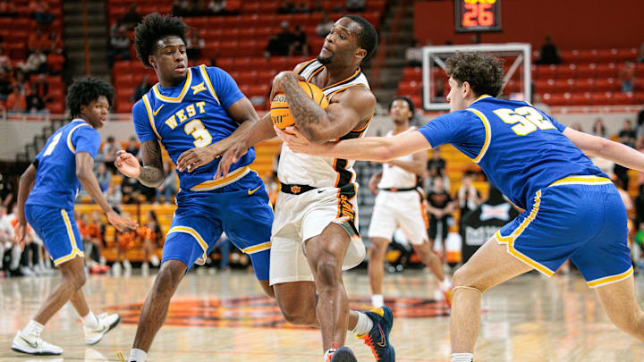Feb 24, 2026; Stillwater, Oklahoma, USA; Oklahoma State Cowboys guard Kanye Clary (1) drives to the basket during the first half against the West Virginia Mountaineers at Gallagher-Iba Arena. Mandatory Credit: William Purnell-Imagn Images