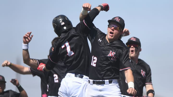 New Home's Ryder Starkey (12) celebrates with Ryder Watkins after a run scored against Ropes in a District 4-2A baseball game Saturday, April 12, 2025, at Zant Field in New Home.