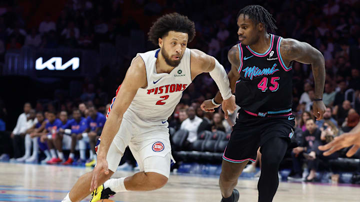 Nov 29, 2025; Miami, Florida, USA; Detroit Pistons guard Cade Cunningham (2) drives to the basket against Miami Heat guard Davion Mitchell (45) during the second half at Kaseya Center. Mandatory Credit: Rhona Wise-Imagn Images