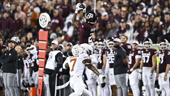 Texas A&M Aggies wide receiver Terry Bussey (2) leaps to catch a pass over Texas Longhorns defensive back Jahdae Barron (7) during the first half. The Longhorns defeated the Aggies 17-7 at Kyle Field. 