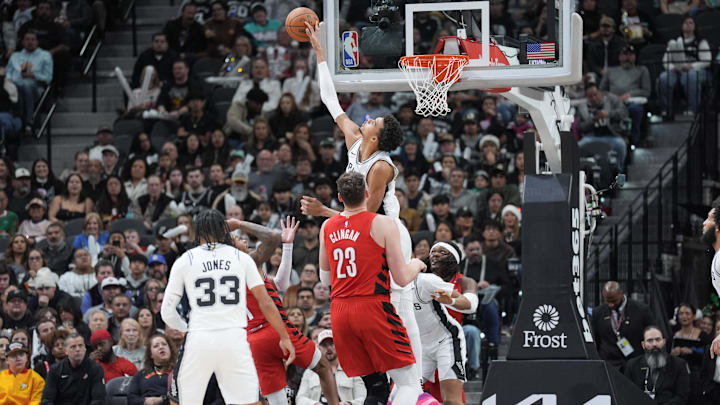 Dec 21, 2024; San Antonio, Texas, USA; San Antonio Spurs center Victor Wembanyama (1) blocks a shot by Portland Trail Blazers guard Anfernee Simons (1) in the second half at Frost Bank Center. Mandatory Credit: Daniel Dunn-Imagn Images Dec 21, 2024; San Antonio, Texas, USA; San Antonio Spurs center Victor Wembanyama (1) blocks a shot by Portland Trail Blazers guard Anfernee Simons (1) in the second half at Frost Bank Center. Mandatory Credit: Daniel Dunn-Imagn Images