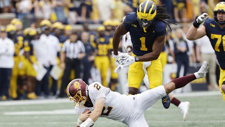 Sep 13, 2025; Ann Arbor, Michigan, USA; Central Michigan Chippewas quarterback Joe Labas (2) is sacked by Michigan Wolverines linebacker Jaishawn Barham (1) in the first half at Michigan Stadium. Mandatory Credit: Rick Osentoski-Imagn Images Sep 13, 2025; Ann Arbor, Michigan, USA; Central Michigan Chippewas quarterback Joe Labas (2) is sacked by Michigan Wolverines linebacker Jaishawn Barham (1) in the first half at Michigan Stadium. Mandatory Credit: Rick Osentoski-Imagn Images