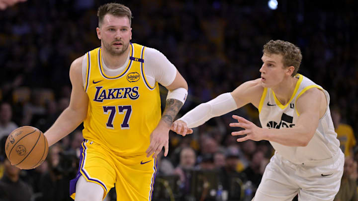 Feb 10, 2025; Los Angeles, California, USA; Los Angeles Lakers guard Luka Doncic (77) is defended by Utah Jazz forward Lauri Markkanen (23) in the first quarter at Crypto.com Arena. Mandatory Credit: Jayne Kamin-Oncea-Imagn Images Feb 10, 2025; Los Angeles, California, USA; Los Angeles Lakers guard Luka Doncic (77) is defended by Utah Jazz forward Lauri Markkanen (23) in the first quarter at Crypto.com Arena. Mandatory Credit: Jayne Kamin-Oncea-Imagn Images