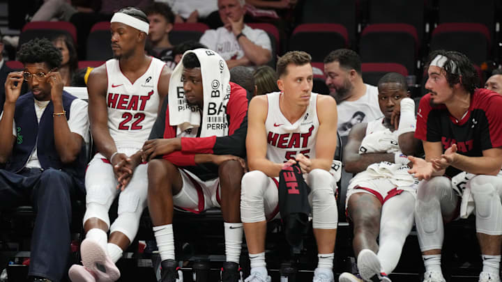 Oct 23, 2024; Miami, Florida, USA;  Miami Heat forward Jimmy Butler (22) and the Heat bench look on late in the game with the score out of reach to the Orlando Magic at Kaseya Center. Mandatory Credit: Jim Rassol-Imagn Images
