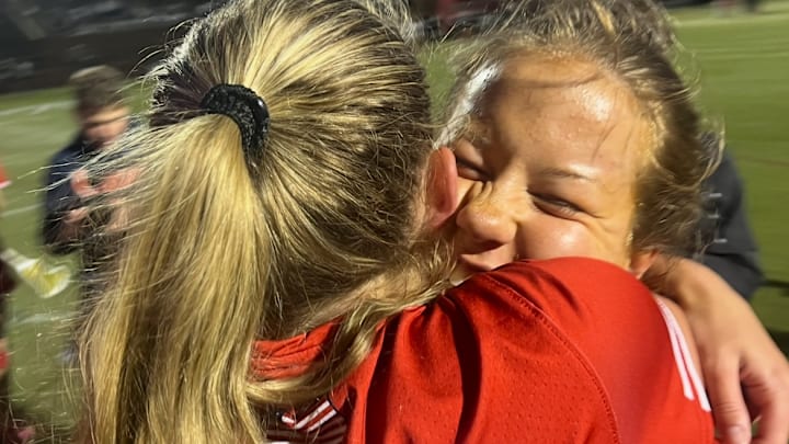Maryvale Prep’s Lainey Minderlein (right) is hugged by teammate Cayden Reese after Friday’s IAAM A Conference lacrosse final. Minderlein, a junior reserve midfielder scored the final five goals for the Lions, who won their first title since 2002 with a 7-5 decision over Archbishop Spalding at USA Lacrosse’s Tierney Field in Sparks, Md.