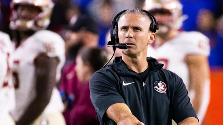 Florida State Seminoles head coach Mike Norvell looks to the replay screen at Steve Spurrier Field at Ben Hill Griffin Stadium in Gainesville, FL on Saturday, November 25, 2023 during the first half. [Doug Engle/Gainesville Sun]