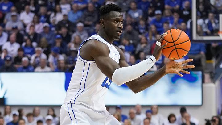 Mar 7, 2026; Provo, Utah, USA; BYU Cougars forward Keba Keita (13) passes the ball during the first half against the Texas Tech Red Raiders at Marriott Center. Mandatory Credit: Aaron Baker-Imagn Images