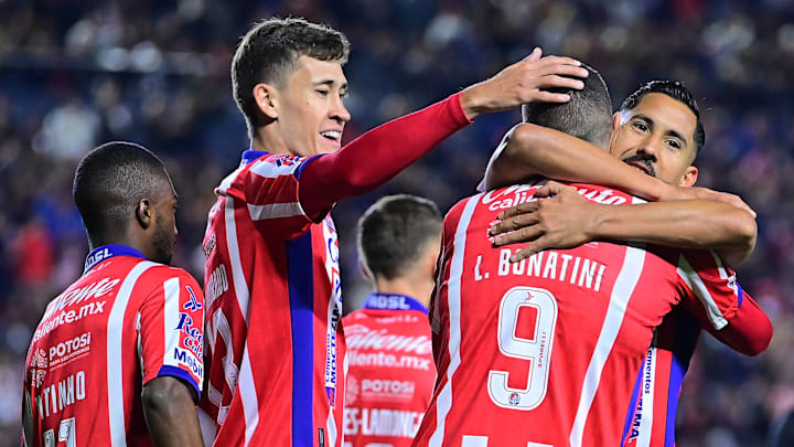 Atlético de San Luis players embrace Leo Bonatini (#9) after he scored the opener in the team's 3-1 victory over UNAM. The win lifted Atleti into first place in the Liga MX standings.