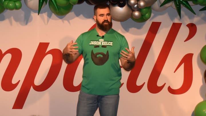 Retired Eagle Jason Kelce, wearing a shirt that promotes his Legend Edition Chunky soup can,