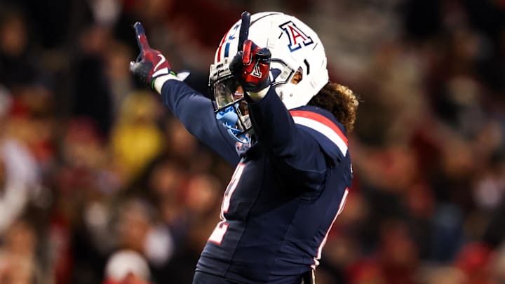 Nov 15, 2024; Tucson, Arizona, USA; Arizona Wildcats defensive back Genesis Smith (12) celebrates a blocked catch during the third quarter against the Houston Cougars at Arizona Stadium