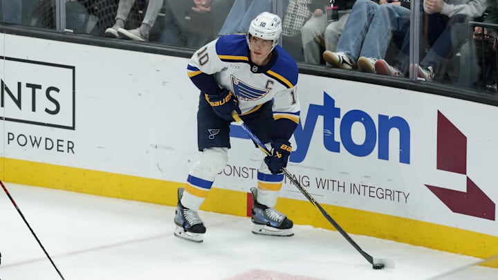 Feb 2, 2025; Salt Lake City, Utah, USA; St. Louis Blues center Brayden Schenn (10) controls the puck during the second period against the Utah Hockey Club at Delta Center. Mandatory Credit: Chris Nicoll-Imagn Images