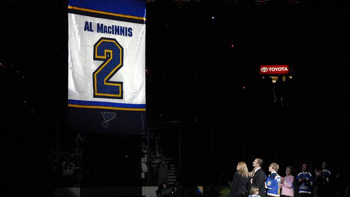 Apr 9, 2006; St. Louis, MO, USA; St. Louis Blues former captain and defenseman Al MacInnis' and his family watch the banner being raised during the celebration of the retirement of his No. 2 jersey at the Savvis Center in St. Louis, MO. Mandatory Credit:Scott Rovak-Imagn Images Copyright © Scott Rovak