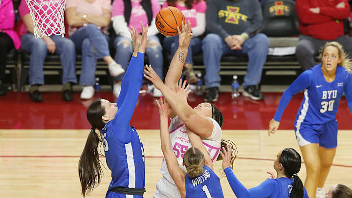 Iowa State Cyclones center Audi Crooks (55) takes a shot around BYU Cougars forward Emma Calvert (25).