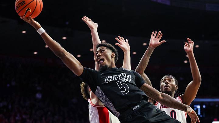 Jan 21, 2026; Tucson, Arizona, USA; The Arizona Wildcats fouls Cincinnati Bearcats guard Sincire Harris (5) during the first half of the game at McKale Memorial Center. Mandatory Credit: Aryanna Frank-Imagn Images Jan 21, 2026; Tucson, Arizona, USA; The Arizona Wildcats fouls Cincinnati Bearcats guard Sincire Harris (5) during the first half of the game at McKale Memorial Center. Mandatory Credit: Aryanna Frank-Imagn Images