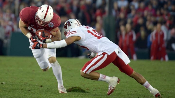 Jan 1, 2013; Pasadena, CA, USA; Wisconsin Badgers defensive back Devin Smith (10) tackles Stanford Cardinal tight end Zach Ertz (86) during the 2013 Rose Bowl game at the Rose Bowl. Mandatory Credit: Kirby Lee-Imagn Images Jan 1, 2013; Pasadena, CA, USA; Wisconsin Badgers defensive back Devin Smith (10) tackles Stanford Cardinal tight end Zach Ertz (86) during the 2013 Rose Bowl game at the Rose Bowl. Mandatory Credit: Kirby Lee-Imagn Images