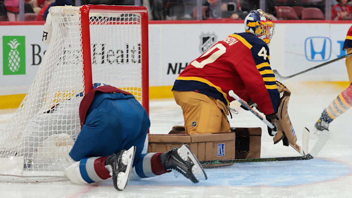 Jan 4, 2026; Sunrise, Florida, USA; Colorado Avalanche left wing Gabriel Landeskog (92) crashes against the goal post during the second period against the Florida Panthers at Amerant Bank Arena. Mandatory Credit: Sam Navarro-Imagn Images