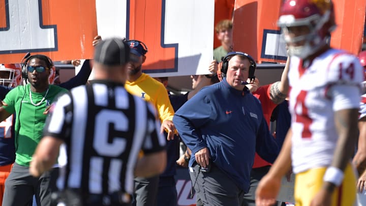 Sep 27, 2025; Champaign, Illinois, USA;  Illinois Fighting Illini head coach Bret Bielema looks on as Southern California Trojans quarterback Jayden Maiava (14) talks with an official during the first half at Memorial Stadium. Mandatory Credit: Ron Johnson-Imagn Images