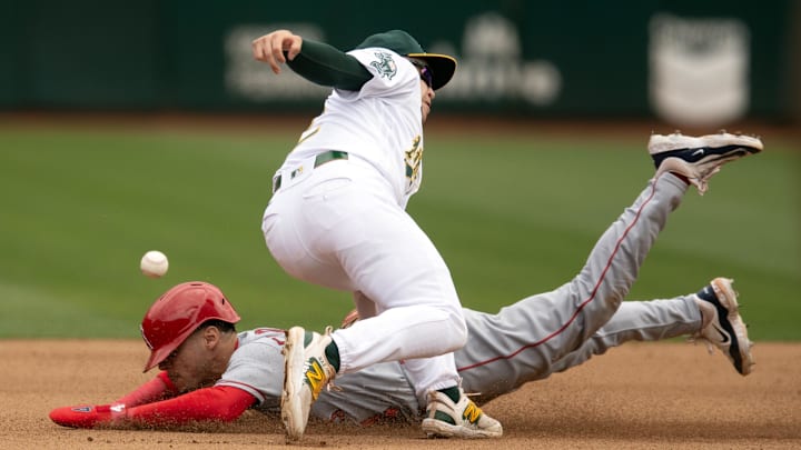 Angels pinch runner Andrew Velazquez (4) steals second base as Oakland Athletics shortstop Nick Allen (2) cannot handle the throw during the seventh inning at Oakland-Alameda County Coliseum on Sept. 2, 2023.