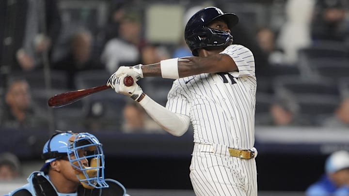 Apr 14, 2025; Bronx, New York, USA; New York Yankees second baseman Jazz Chisholm Jr. (13) hits a home run against the Kansas City Royals during the fourth inning at Yankee Stadium. 