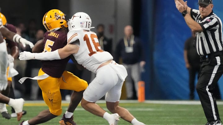 Arizona State wide receiver Melquan Stovall (5) is tackled by Texas defensive back Michael Taaffe (16) after a catch during the fourth quarter in the Chick-fil-A Peach Bowl in Atlanta on Jan. 1, 2025. The play was reviewed for targeting but was not called.