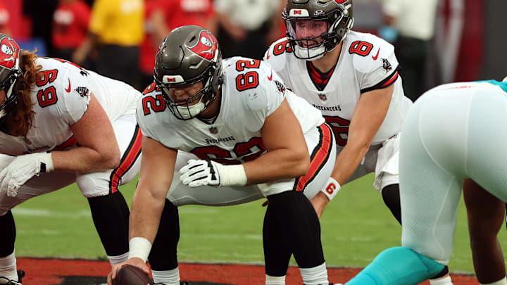 Aug 23, 2024; Tampa, Florida, USA; Tampa Bay Buccaneers center Graham Barton (62) hikes the ball to Tampa Bay Buccaneer quarterback Baker Mayfield (6) against the Miami Dolphins  during the first quarter at Raymond James Stadium. Mandatory Credit: Kim Klement Neitzel-Imagn Images