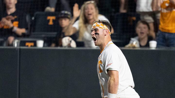 Tennessee's Stone Lawless (27) celebrates after scoring a run against Texas during an NCAA college baseball game in Knoxville, Tennessee on May 8, 2026.