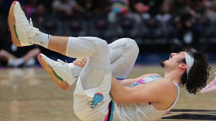 Feb 28, 2025; Miami, Florida, USA; Miami Heat guard Jaime Jaquez Jr. (11) reacts after an apparent leg injury against the Indiana Pacers during the third quarter at Kaseya Center. Mandatory Credit: Sam Navarro-Imagn Images