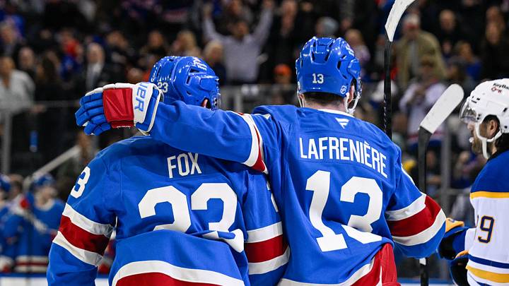 Apr 8, 2026; New York, New York, USA; New York Rangers defenseman Adam Fox (23) celebrates his goal with New York Rangers left wing Alexis Lafrenière (13) against the Buffalo Sabres during the second period at Madison Square Garden. Mandatory Credit: Dennis Schneidler-Imagn Images