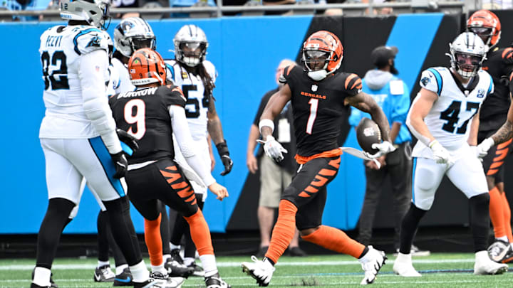 Sep 29, 2024; Charlotte, North Carolina, USA;  Cincinnati Bengals wide receiver Ja'Marr Chase (1) celebrates with quarterback Joe Burrow (9) after a touchdown catch in the second quarter at Bank of America Stadium. Mandatory Credit: Bob Donnan-Imagn Images